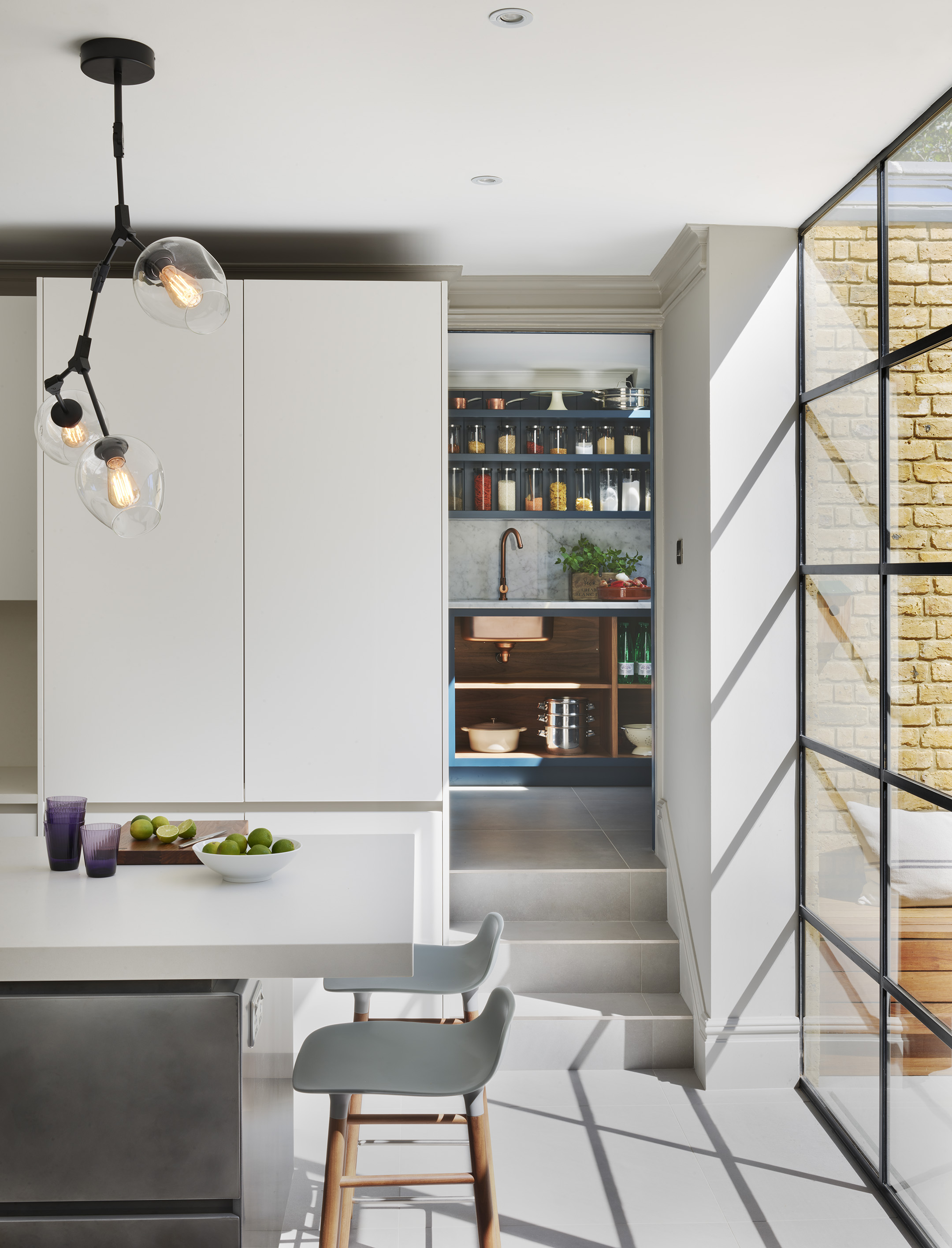 Kitchen lighting island in a contemporary kitchen by roundhouse with bespoke cabinetry