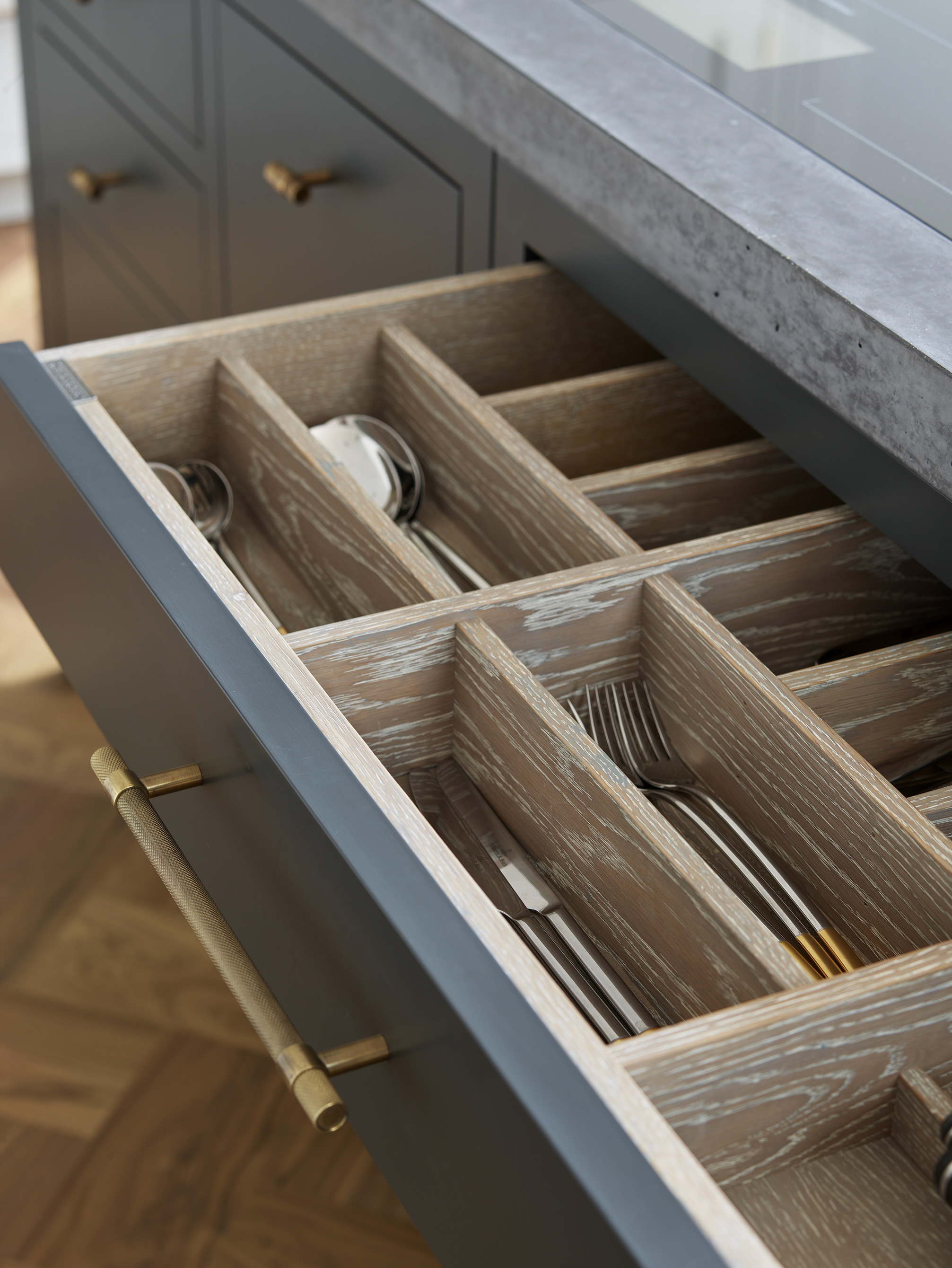 kitchen cupboards with drawers in kitchen island by Roundhouse