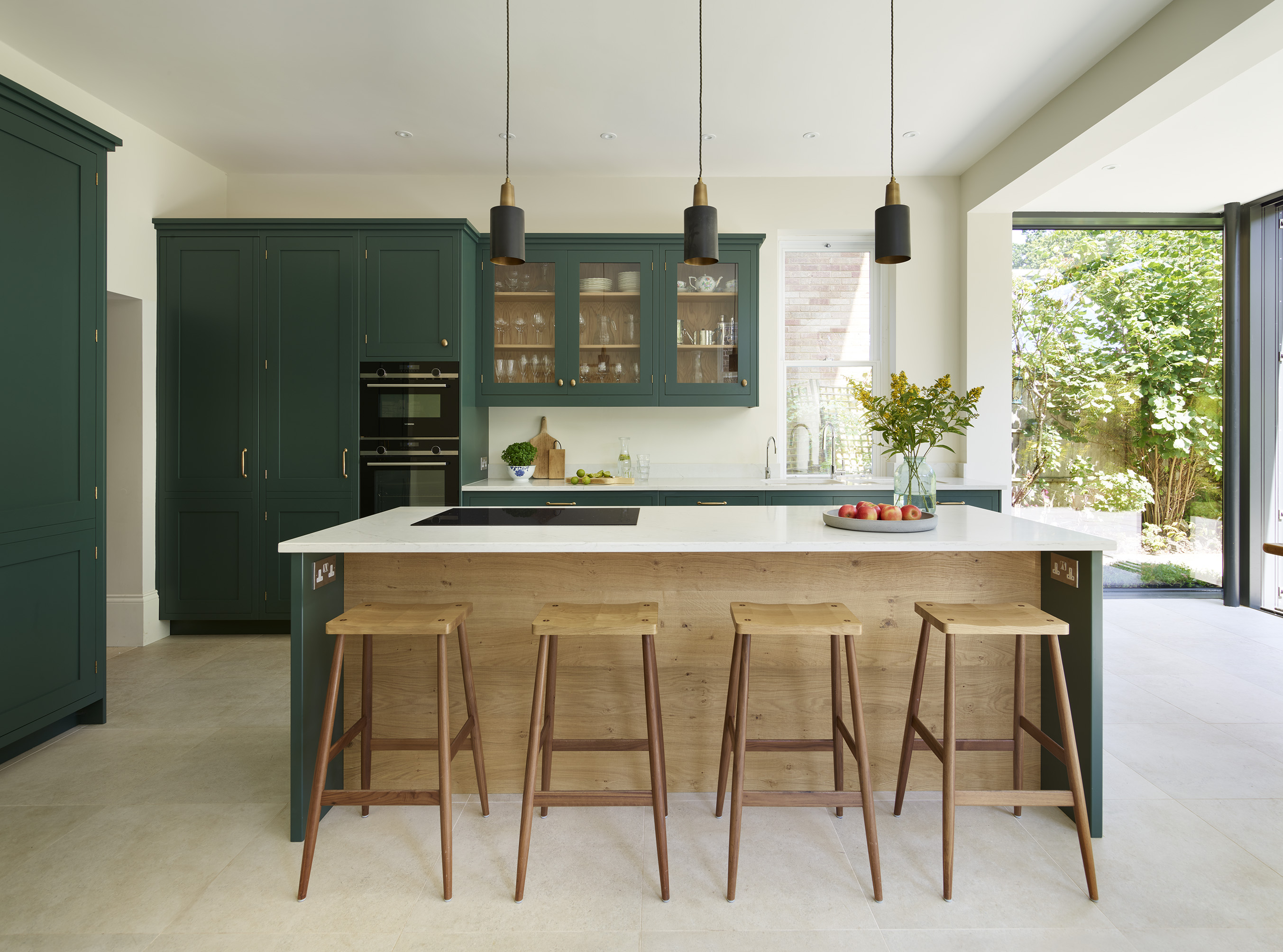 Luxurious kitchen design with kitchen islands by Roundhouse with white work surfaces