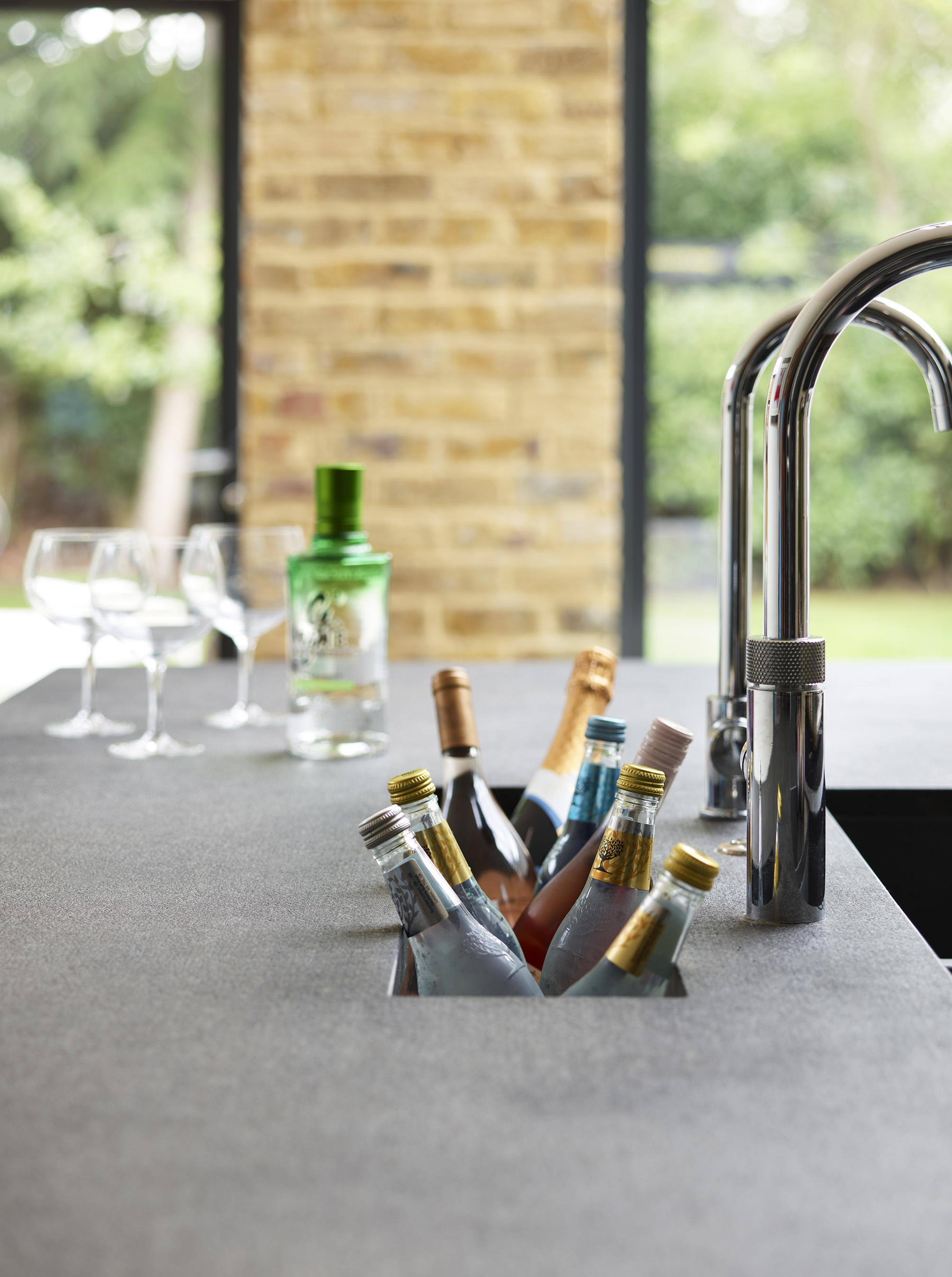 Bespoke wine storage with textured work surfaces