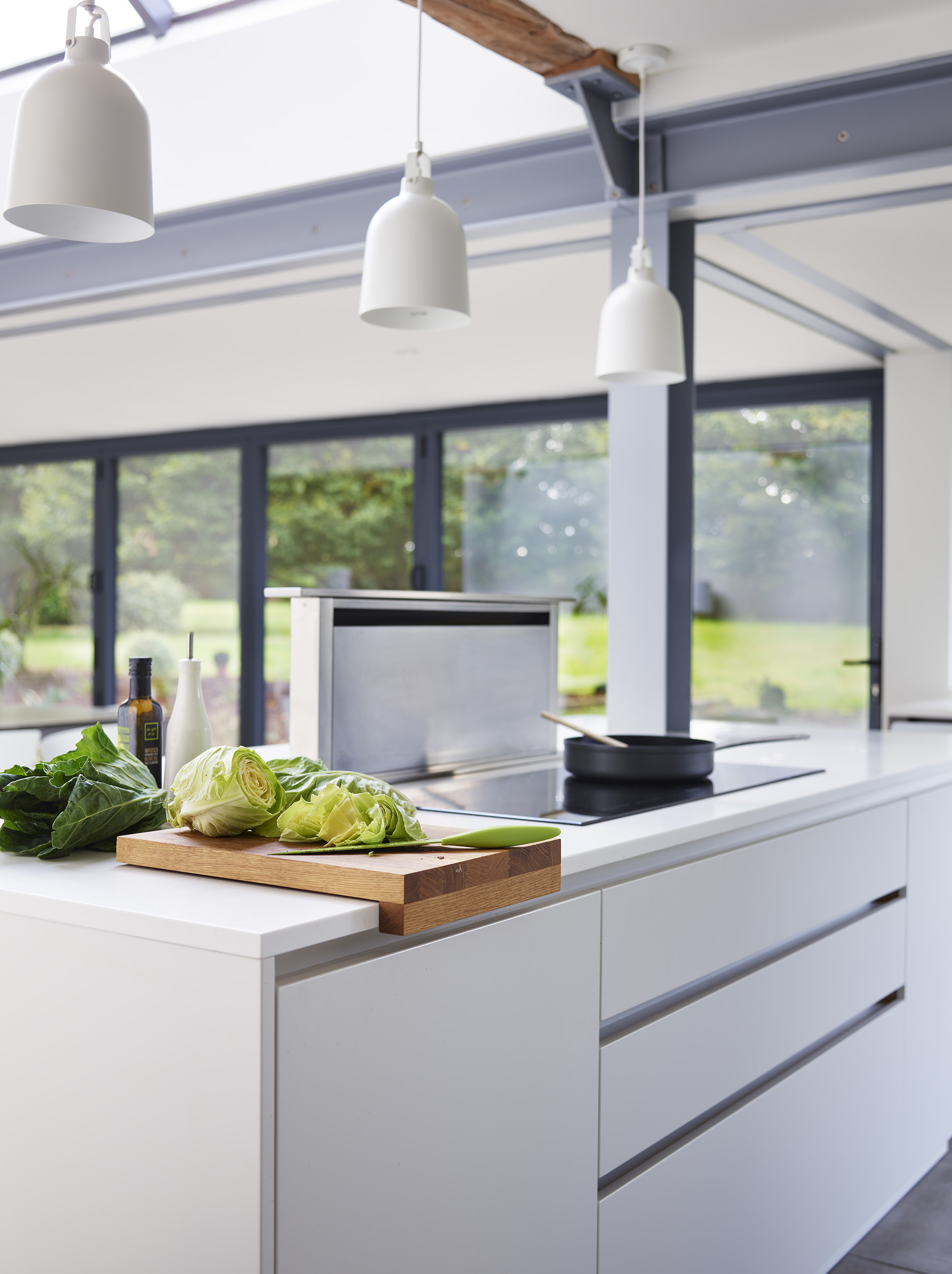 kitchen lighting over a kitchen island with white work surface