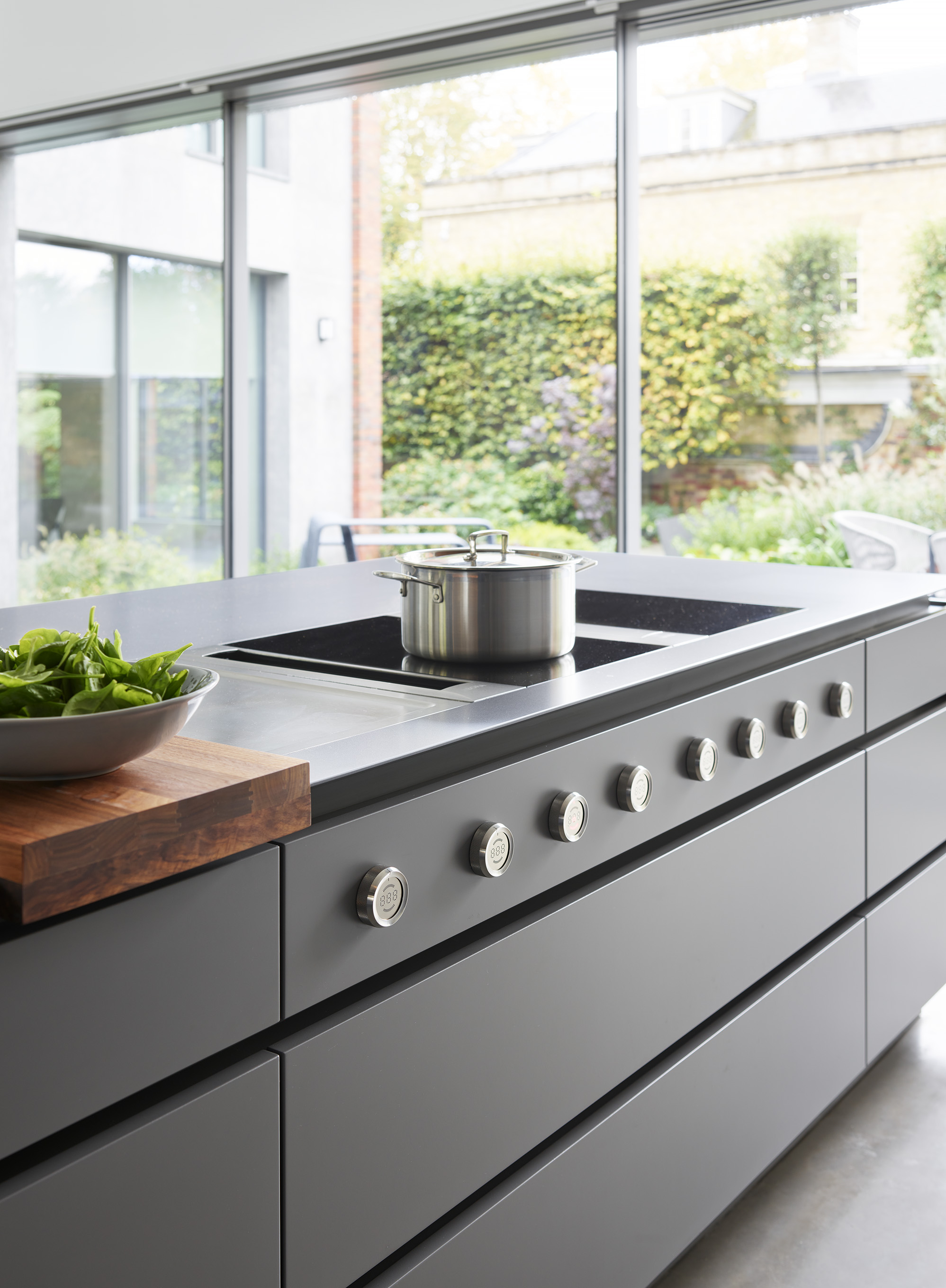 Luxury kitchen appliances with kitchen islands by Roundhouse and grey bespoke cabinets