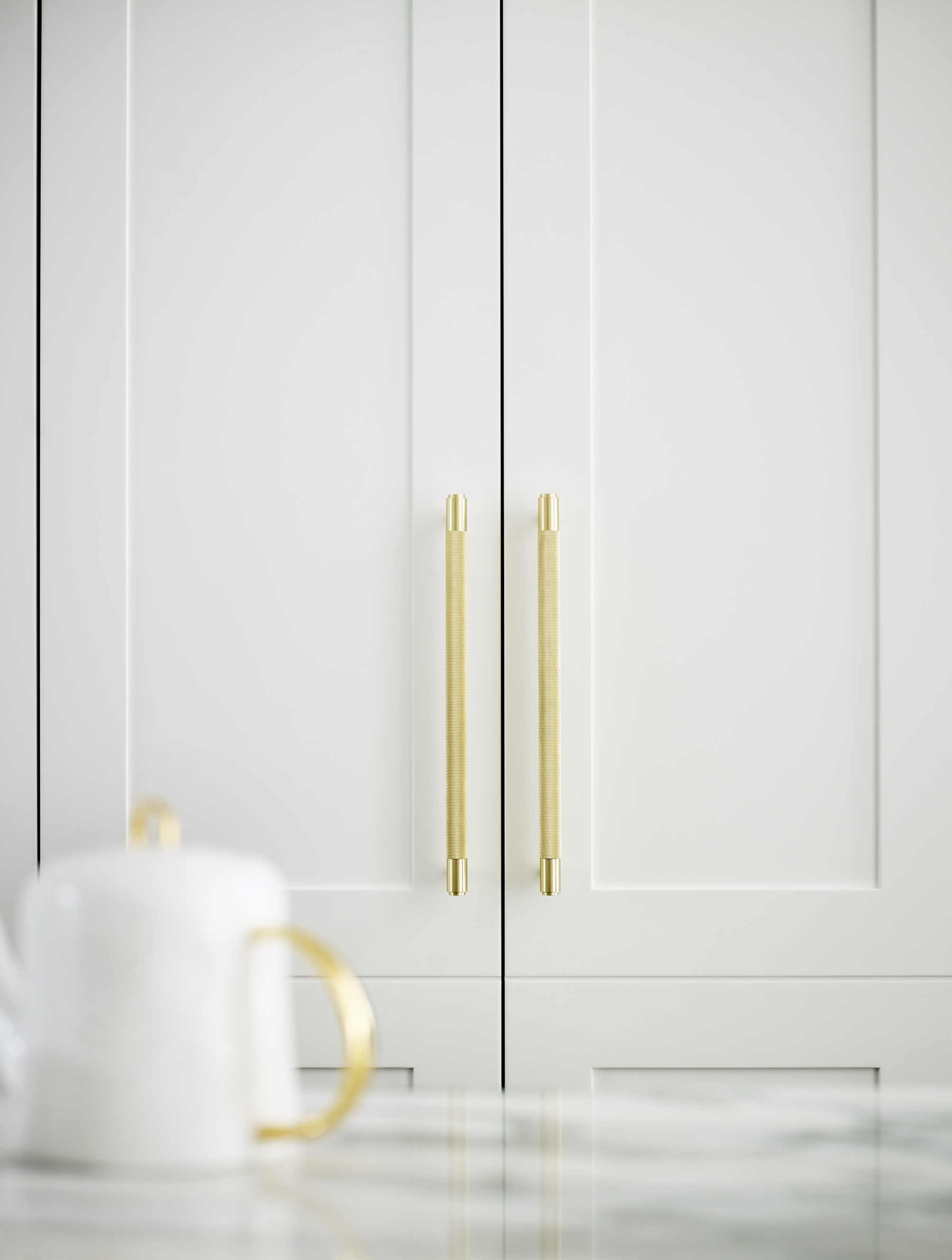 modern kitchens white by Roundhouse with white brass kitchen handles
