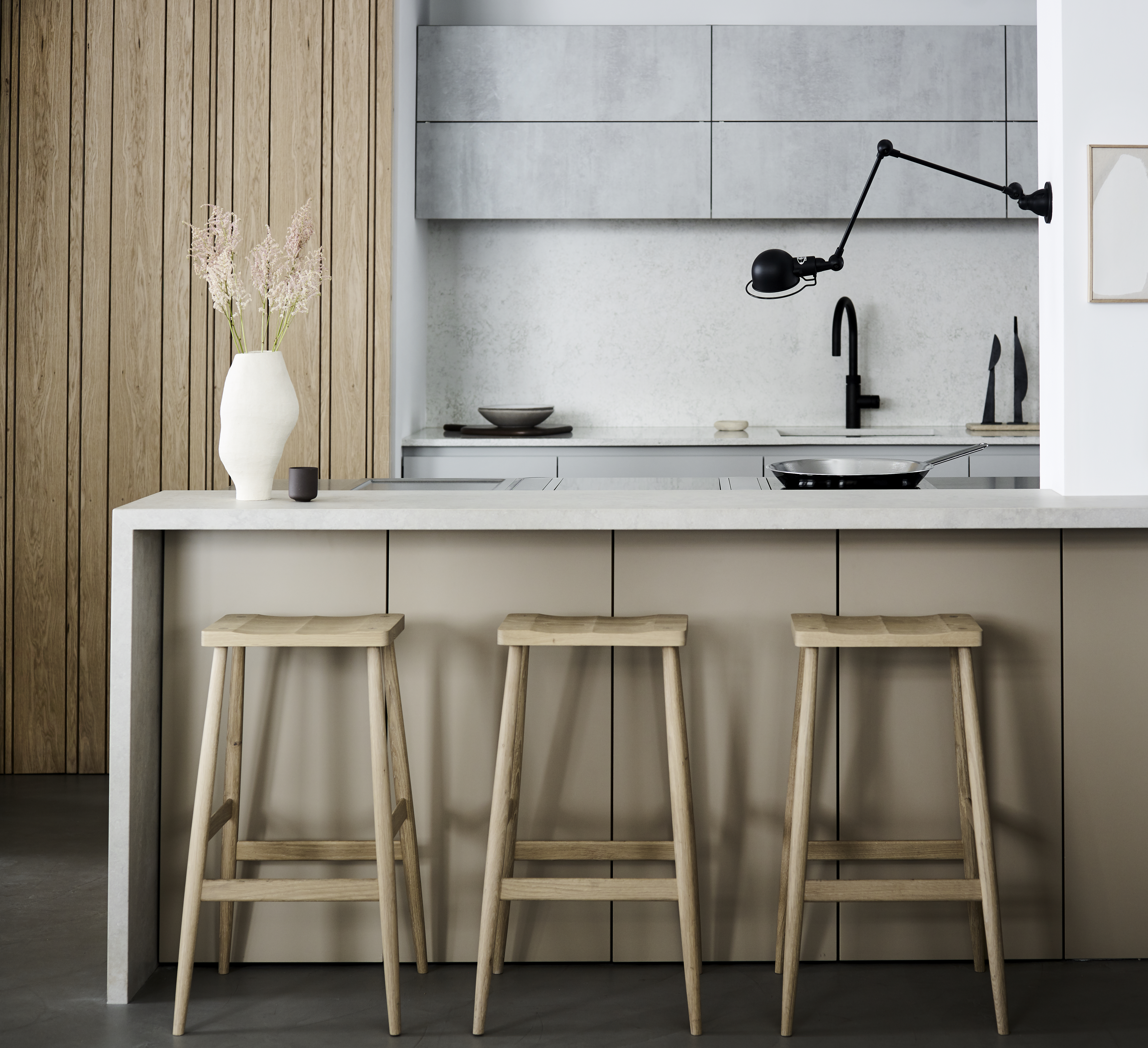 Luxury kitchen by Roundhouse with bespoke kitchen island in solid oak with concrete work surface