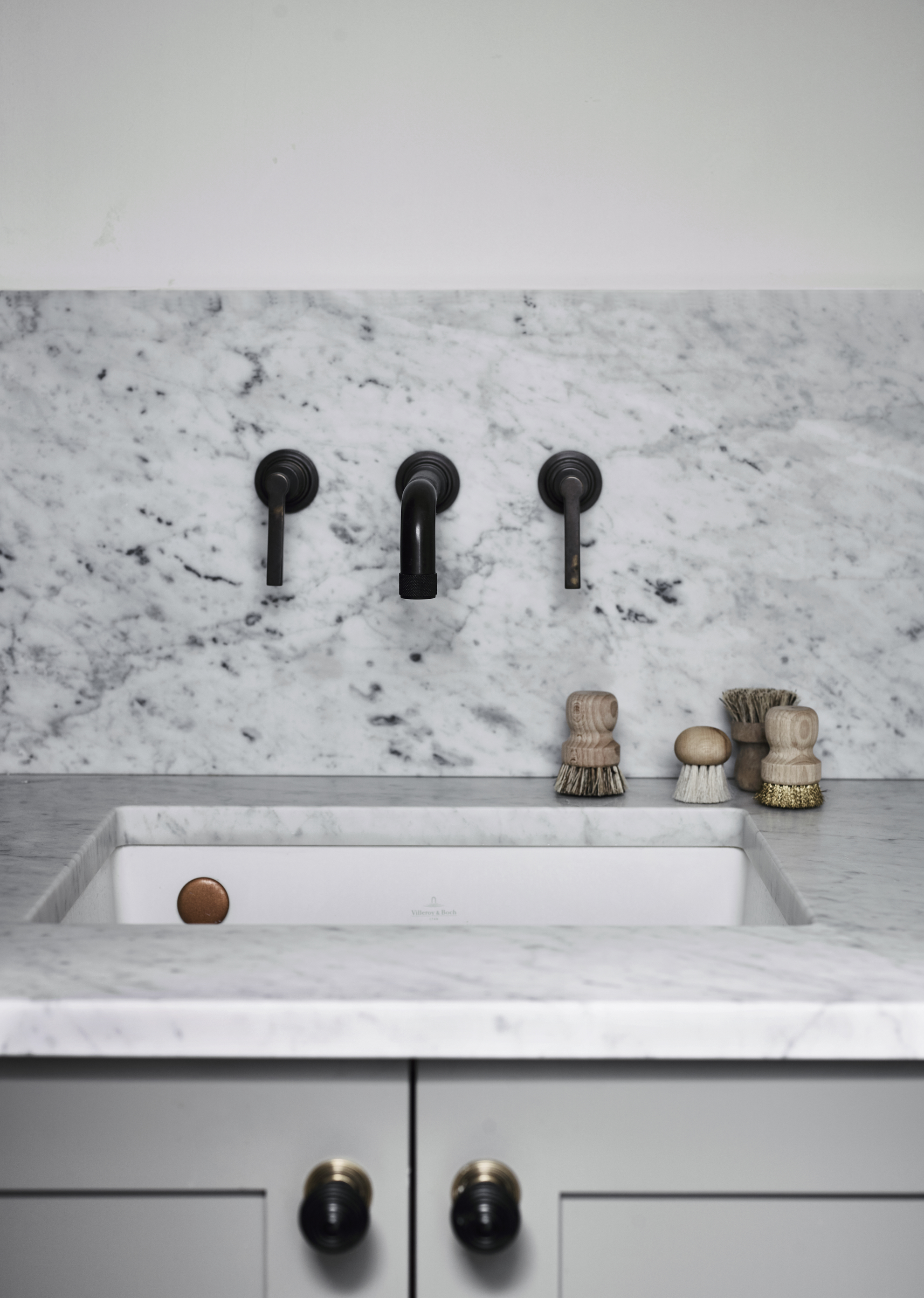 Luxury kitchen sink with kitchen cupboard handles and marble work surface