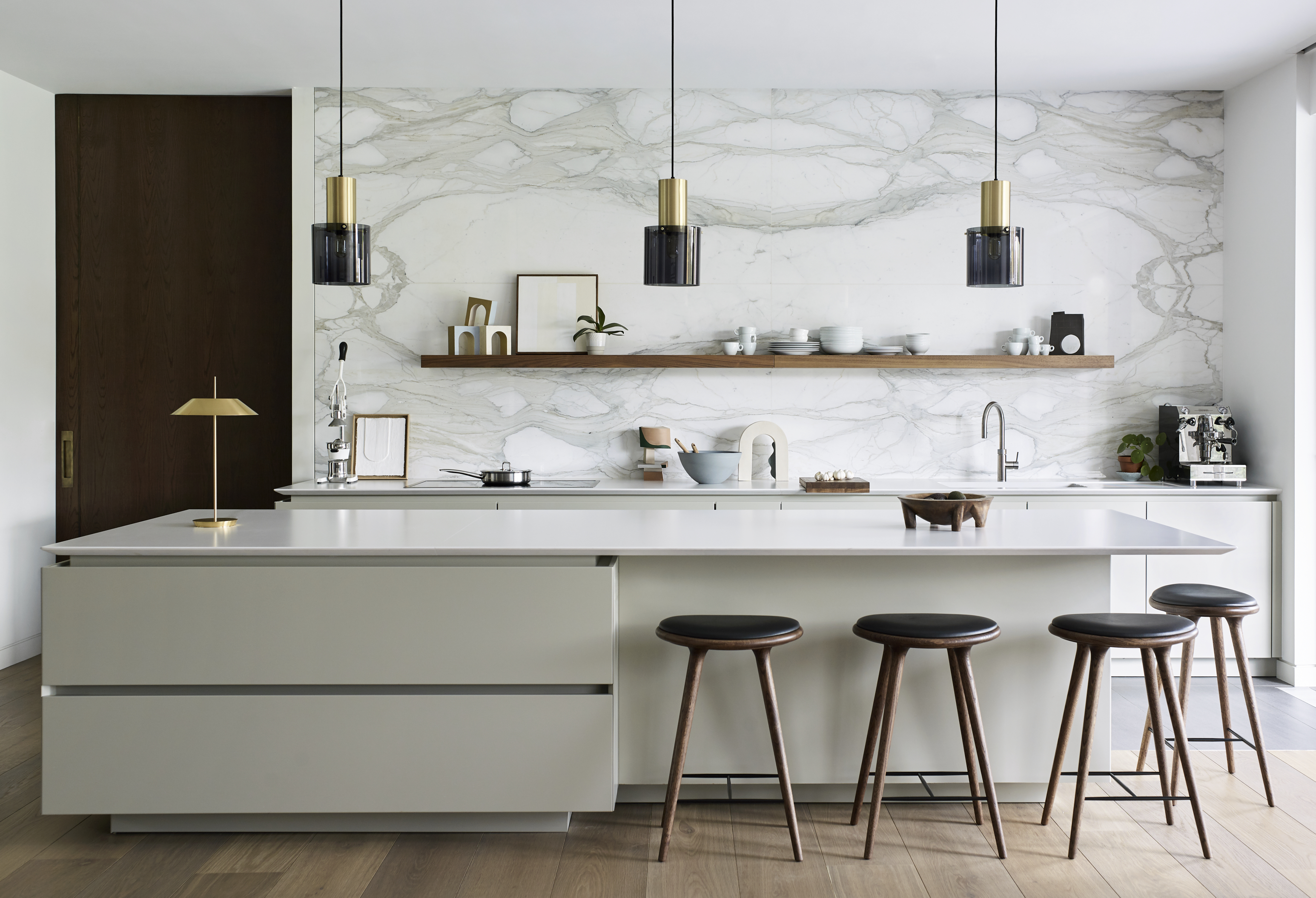 Modern kitchens by Roundhouse with bespoke kitchen island with marble work surface