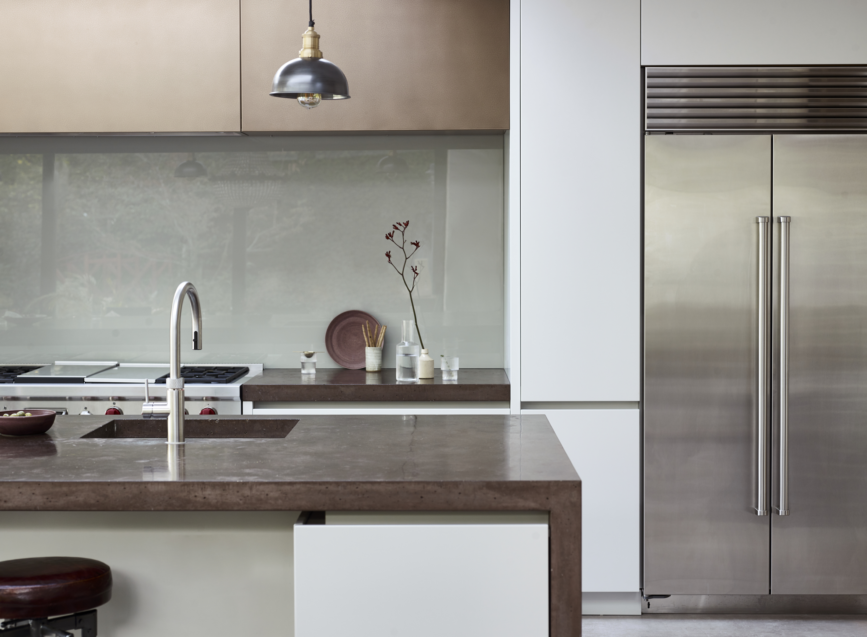 Bespoke kitchen with bespoke brass kitchen island and work surface