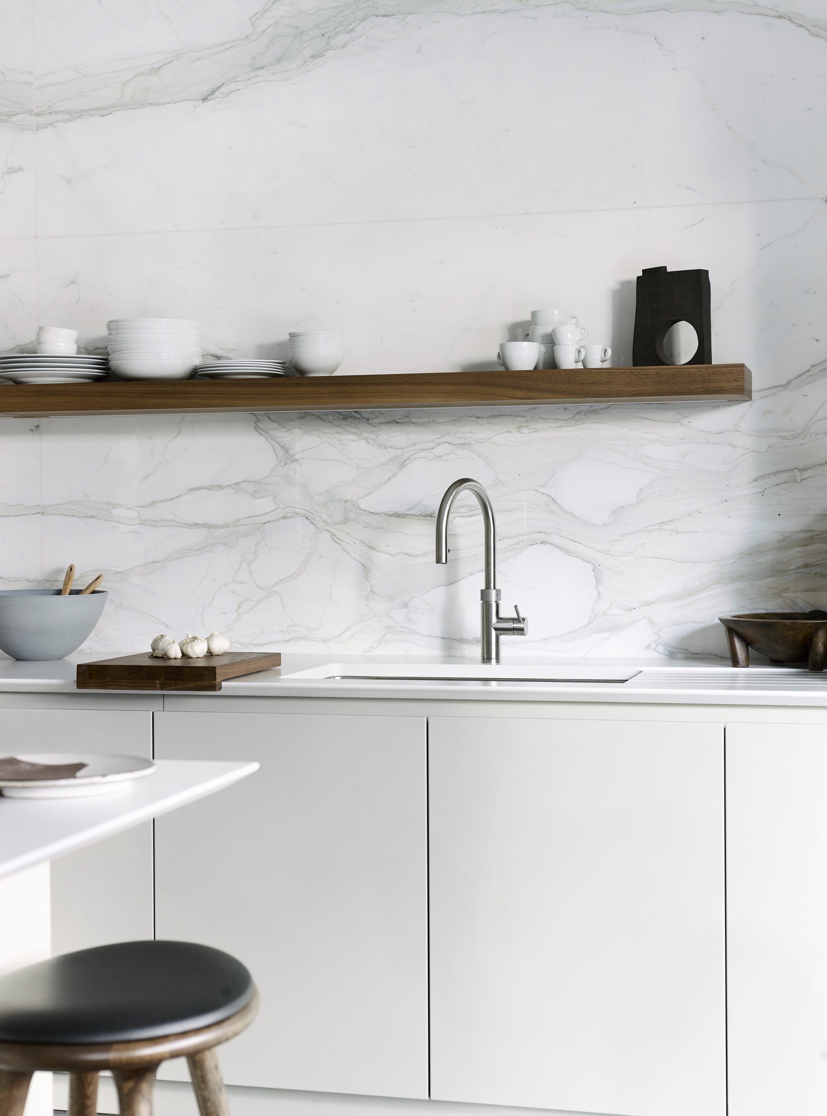 Designer kitchen with luxury kitchen sink and marble work surfaces