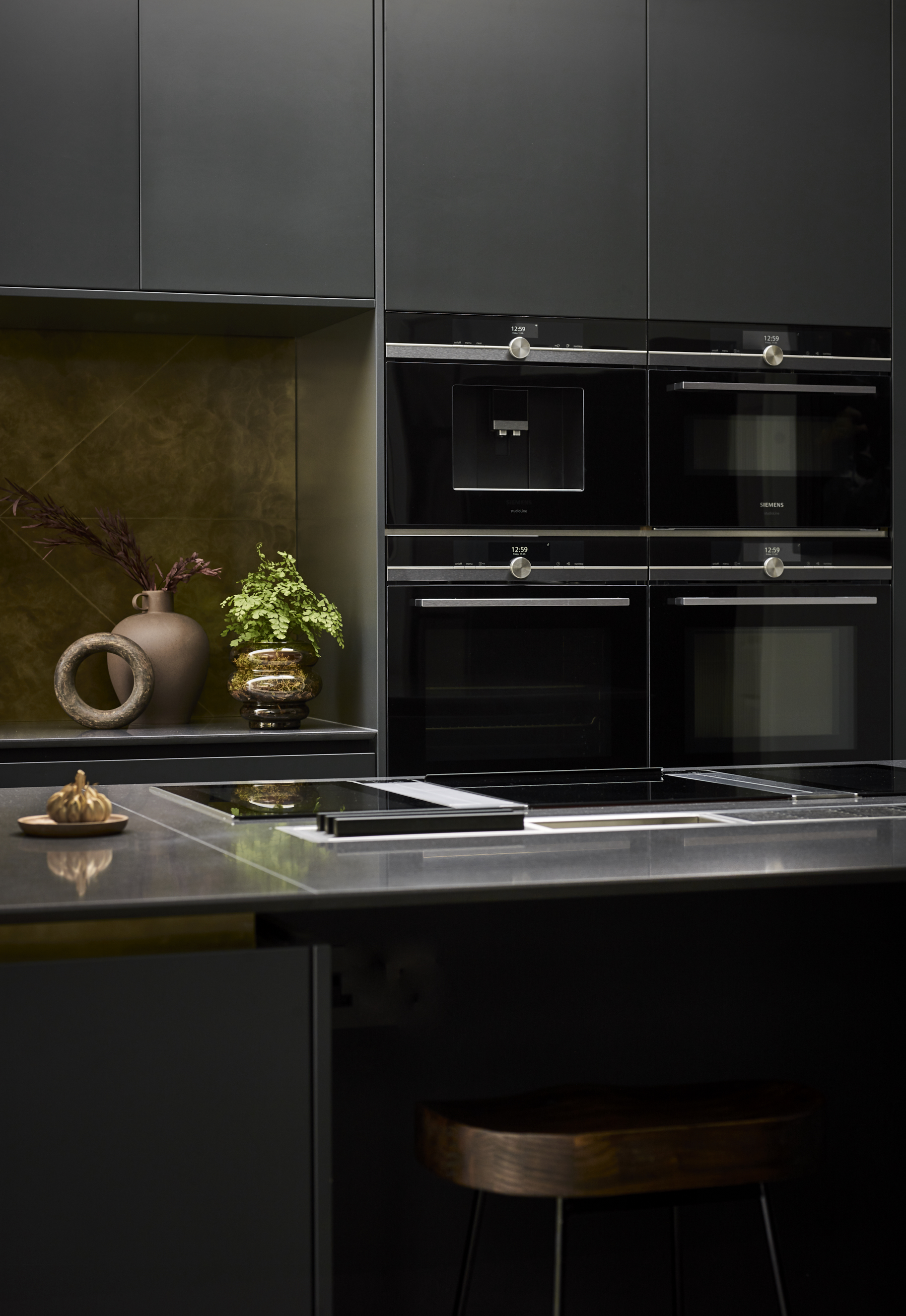 Luxury kitchen appliances with bespoke kitchen island and stone work surface