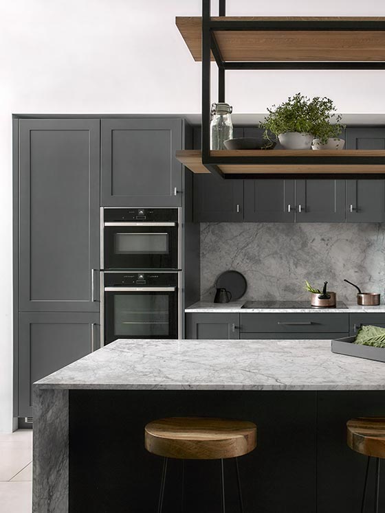 Modern designer bespoke kitchen in grey with marble worktop