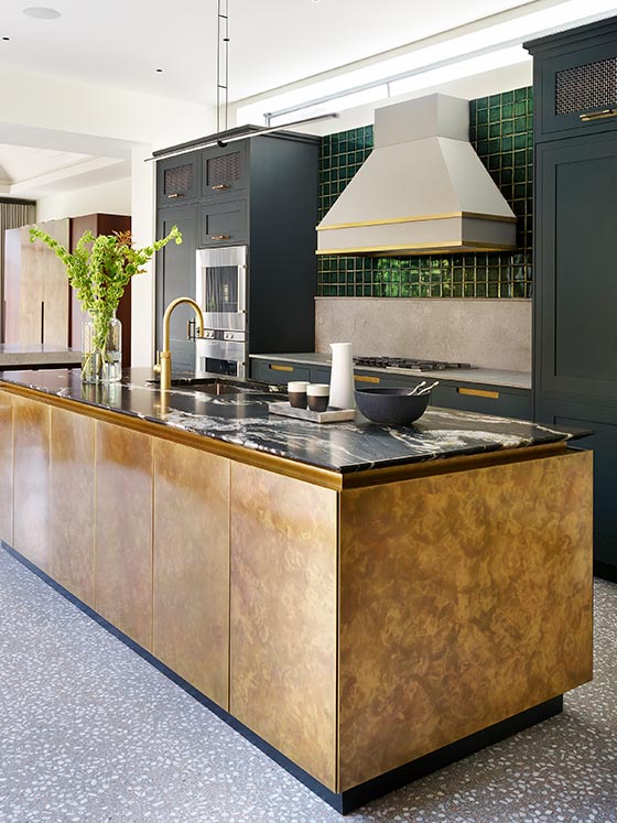 Handmade bespoke kitchen with brass island and marble worktop