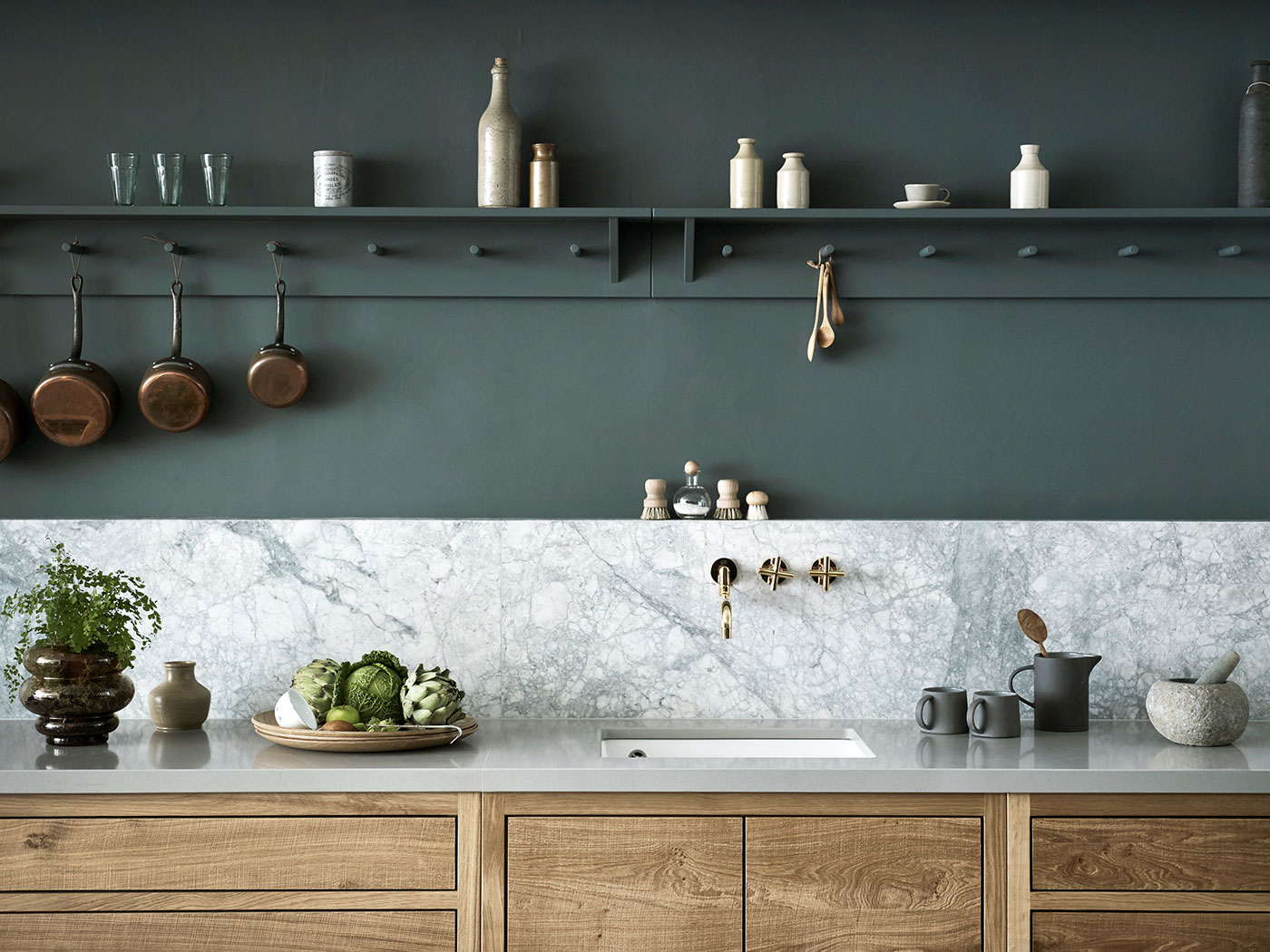 Luxury kitchen in wood with grey marble worktop