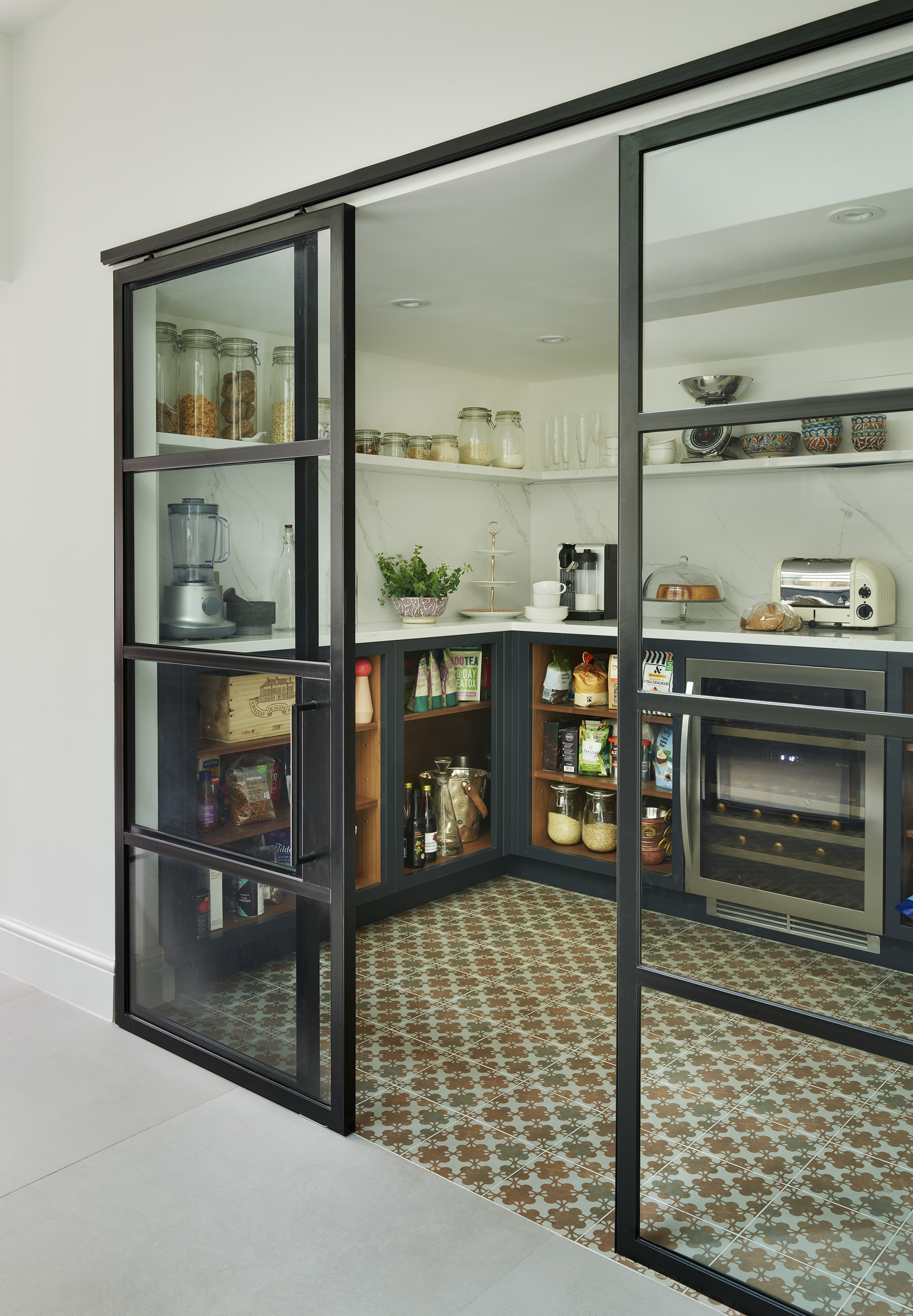 Luxury bespoke kitchen larder with sliding doors