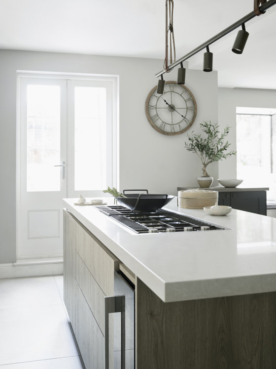 Luxury bespoke kitchen with oak island and white worktop