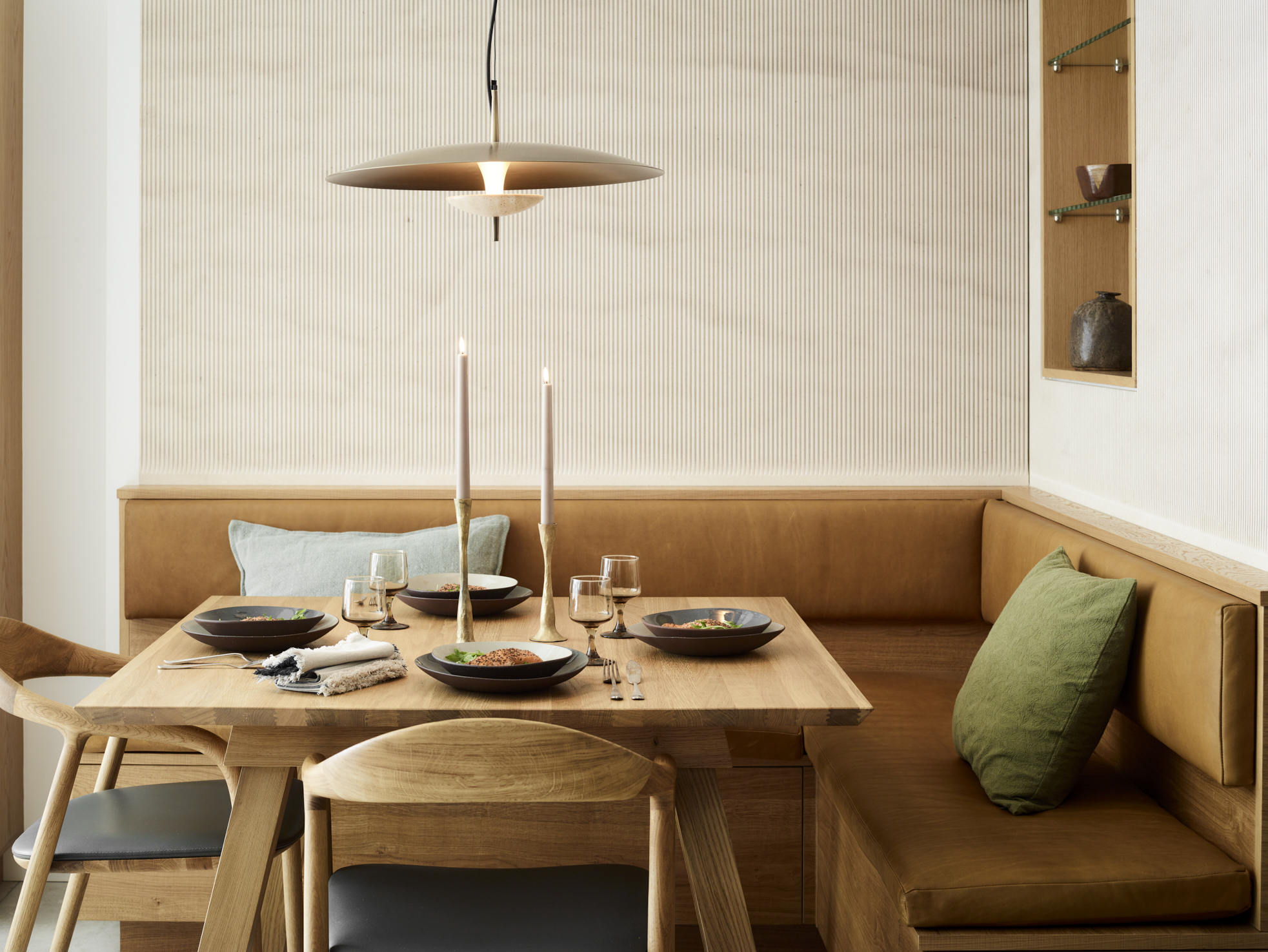 Roundhouse Design workshop featuring traditional woodworking tools displayed on pegboard wall with brand signage, workbench with various hand tools, chisels, planes, and measuring equipment in authentic British craftsman's workspace