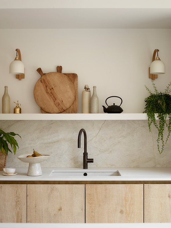 Rough sawn oak cabinetry with Taj Mahal quartzite splashback, open shelving and black tap in the Ashbury bespoke kitchen by Roundhouse Design.
