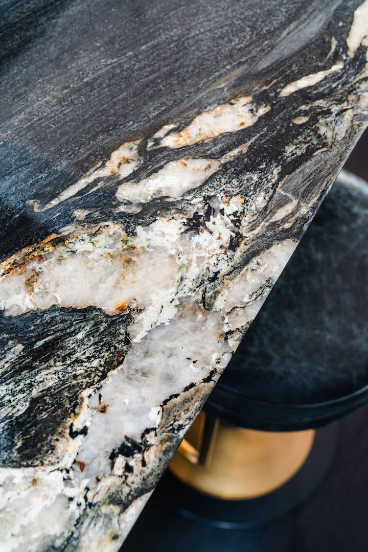 Close-up of dramatic natural stone worktop showcasing distinctive veining and mineral detail