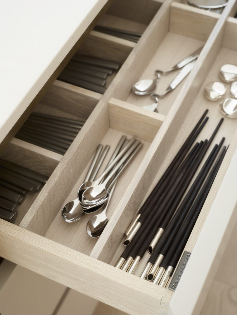 Solid oak bespoke cutlery drawer with handcrafted internal storage and precision joinery by Roundhouse Design.