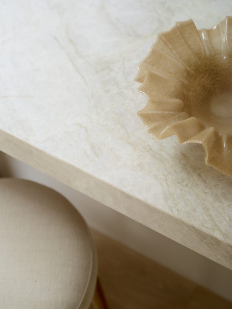 Close-up of leathered Taj Mahal quartzite worktop in the Ashbury bespoke kitchen by Roundhouse Design.