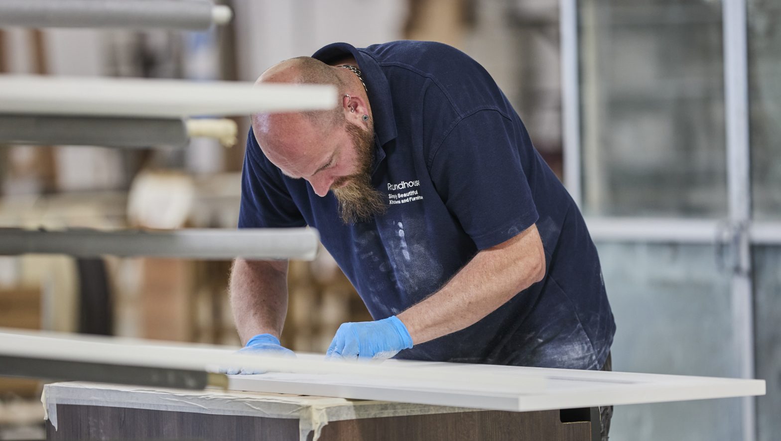 Roundhouse Factory worker, quality checking kitchen materials