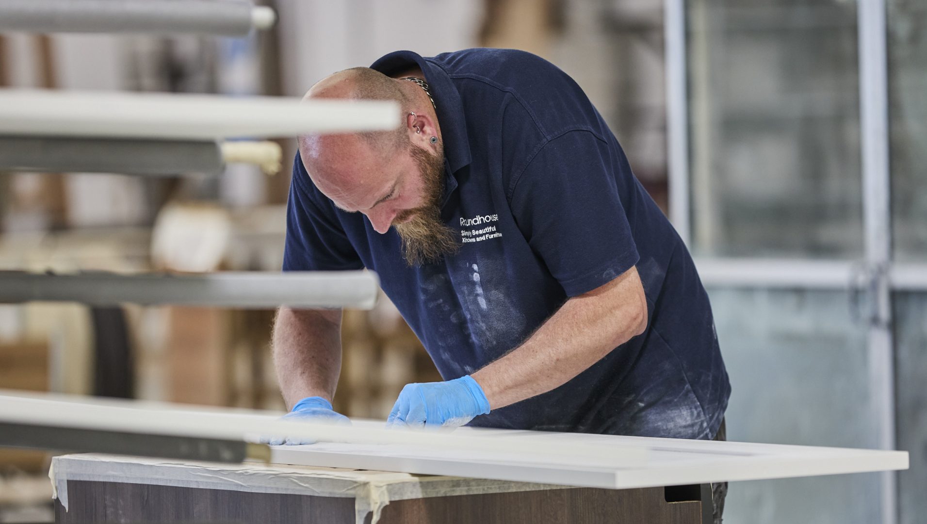 Roundhouse Factory worker, quality checking kitchen materials